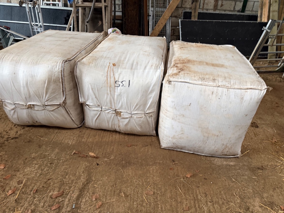 Three bales of raw fleece in the Lydford barn